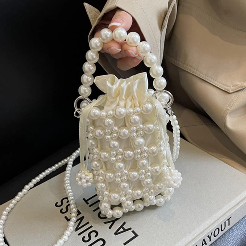 高级感洋气包包女春夏2025新款小众设计珍珠斜挎包镂空迷你手机包