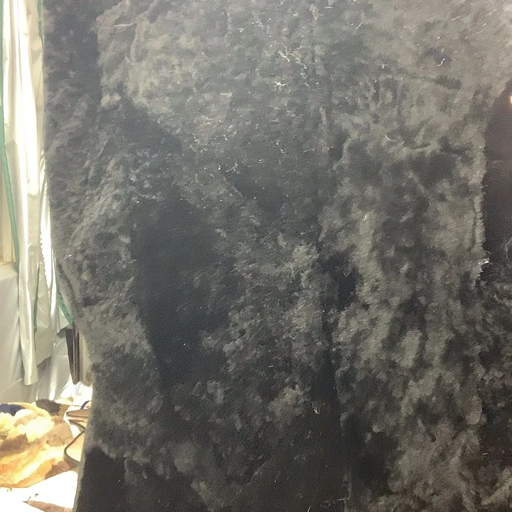 二***。羊毛羊皮毛一体黑色拼接短毛后排一个微瑕