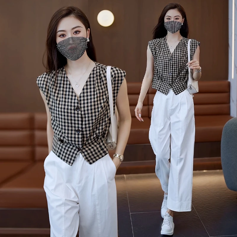 时尚拼接单排多扣夏季格子无袖衬衫女2025新款复古韩版黑白上衣潮