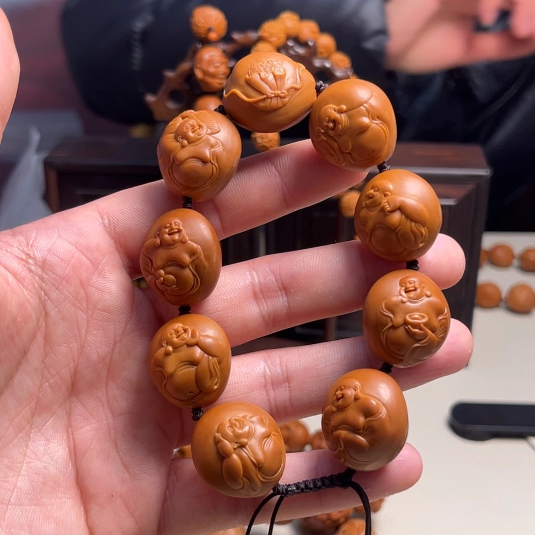 橄榄核吊坠玖****。浮雕弥勒