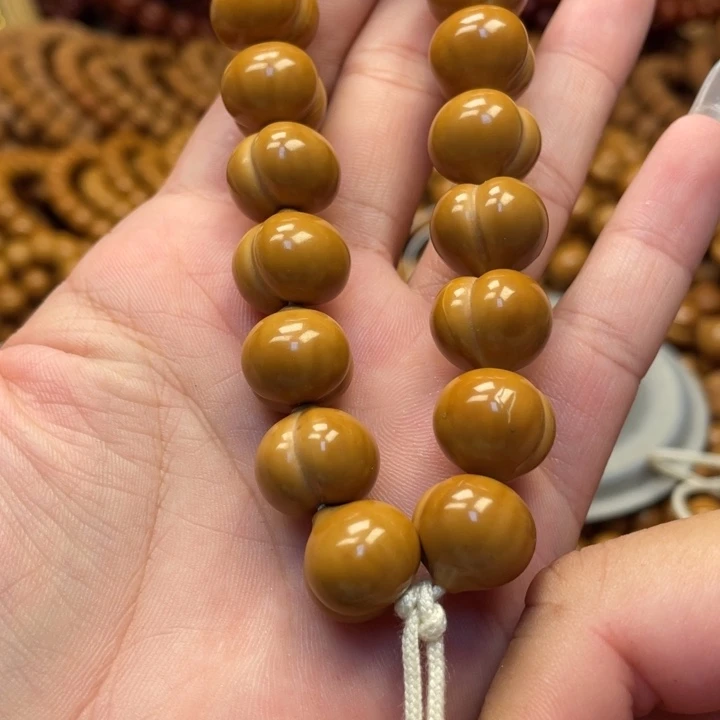 巨****核桃微瑕亮面屁桃手持
