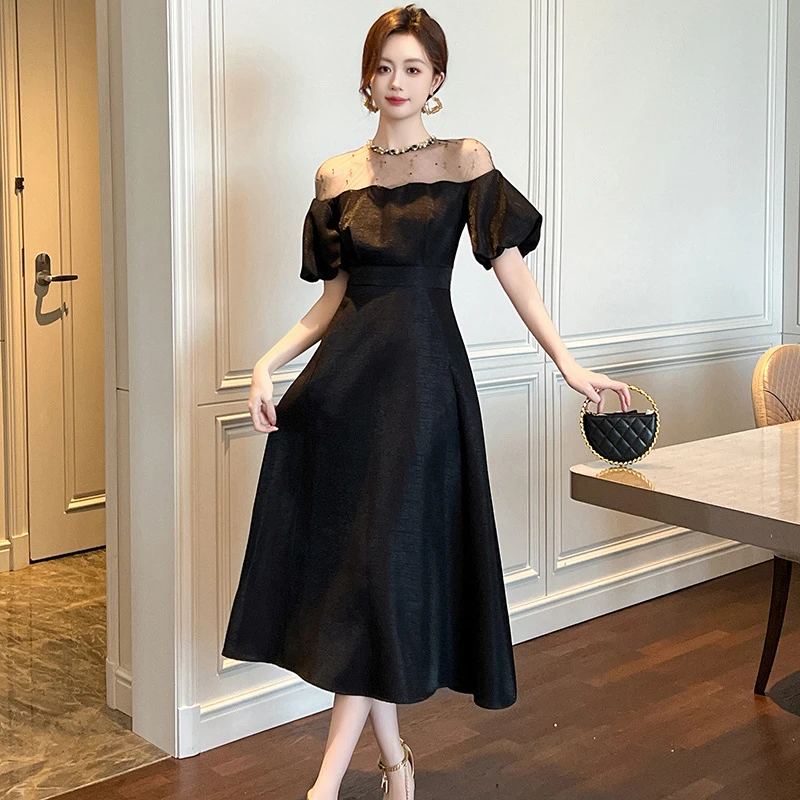 新款高端礼服裙子高贵夏季小众气质显瘦长款白色泡泡袖黑色连衣裙