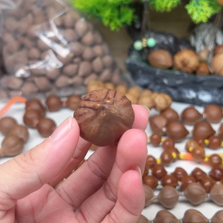 无***朕橄榄核吊坠28素核四花