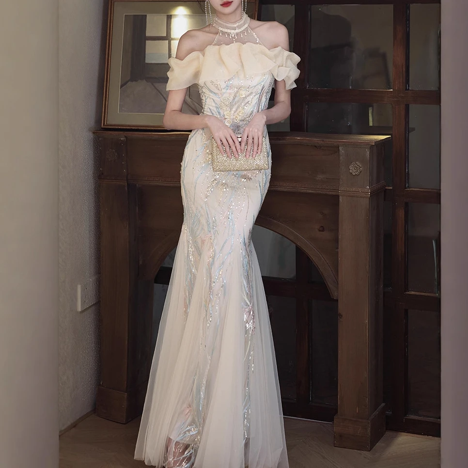 宴会晚礼服女2025新款挂脖晨袍年会主持人香槟色鱼尾订婚晚礼服裙