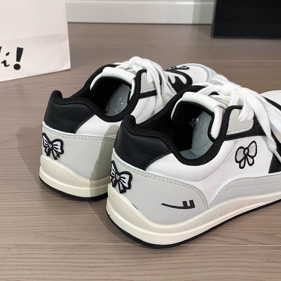 回力原创蝴蝶结刺绣小白鞋女2025新款德训鞋设计感学生百搭保暖鞋
