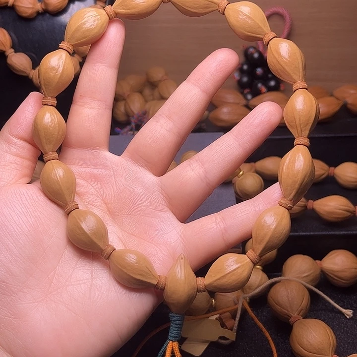 吊坠橄榄核直心三面佛手持15.24