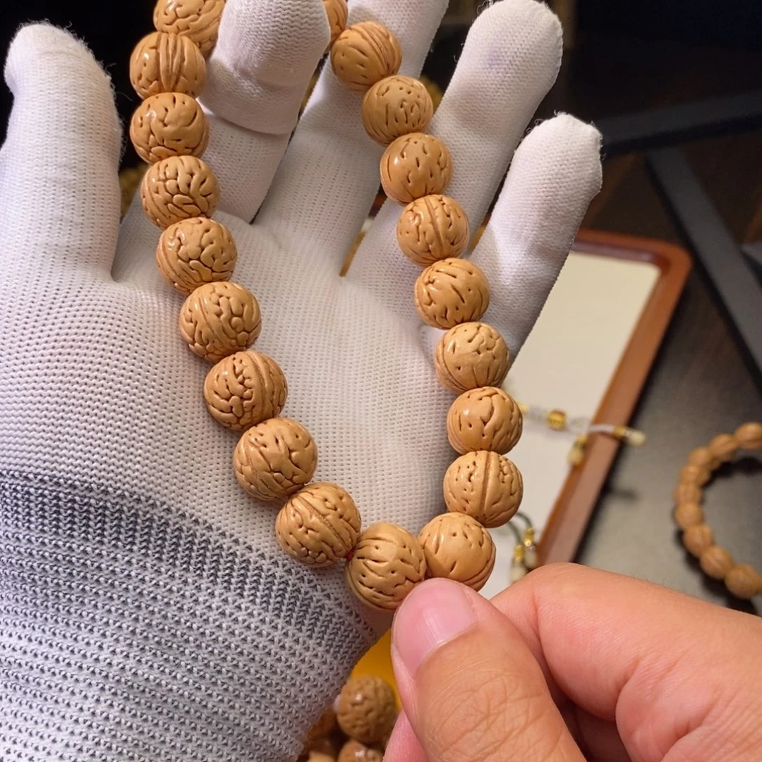 健***安桃核吊坠盘锦野生桃核奶油肠纹手持