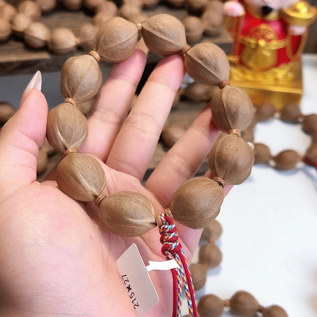 阿***李橄榄核手串/手链梅林