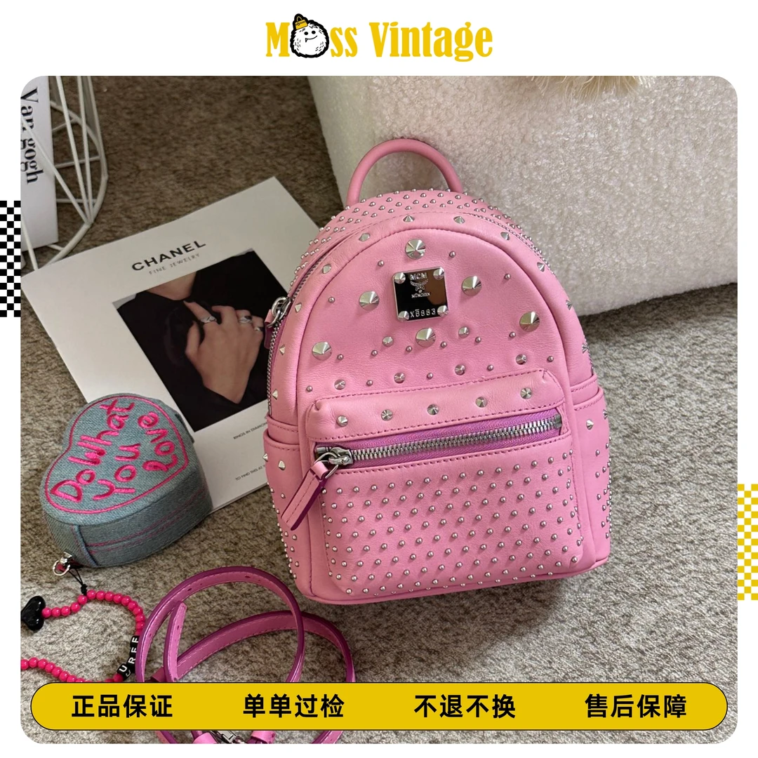 99新 MCM 粉色铆钉双肩包/77197