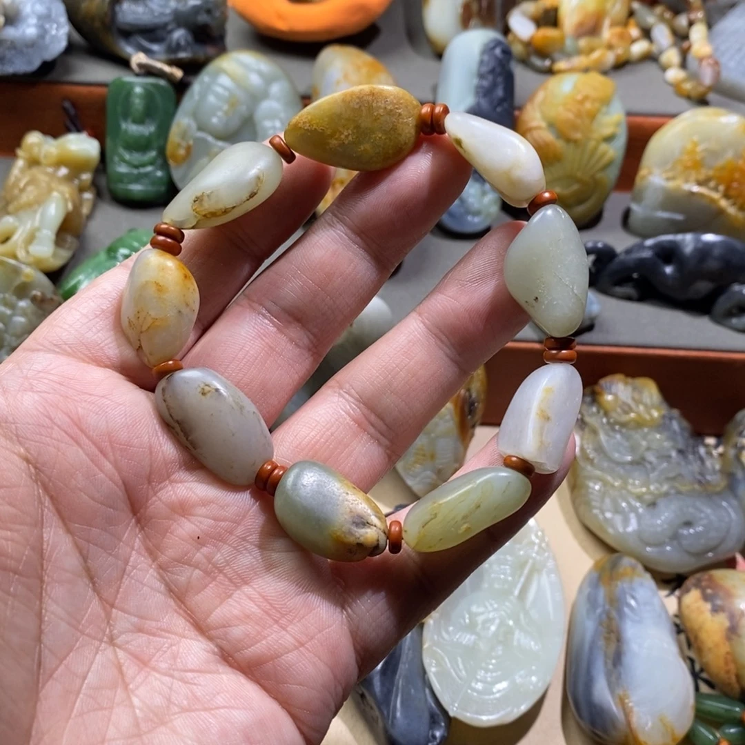 刘***助和田玉未镶嵌把件