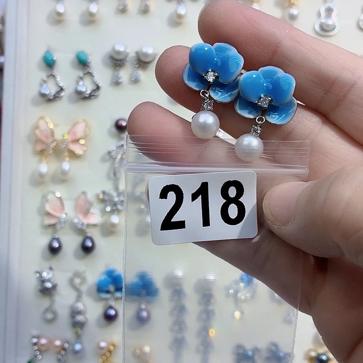 乙***鱼淡水珍珠合金耳饰