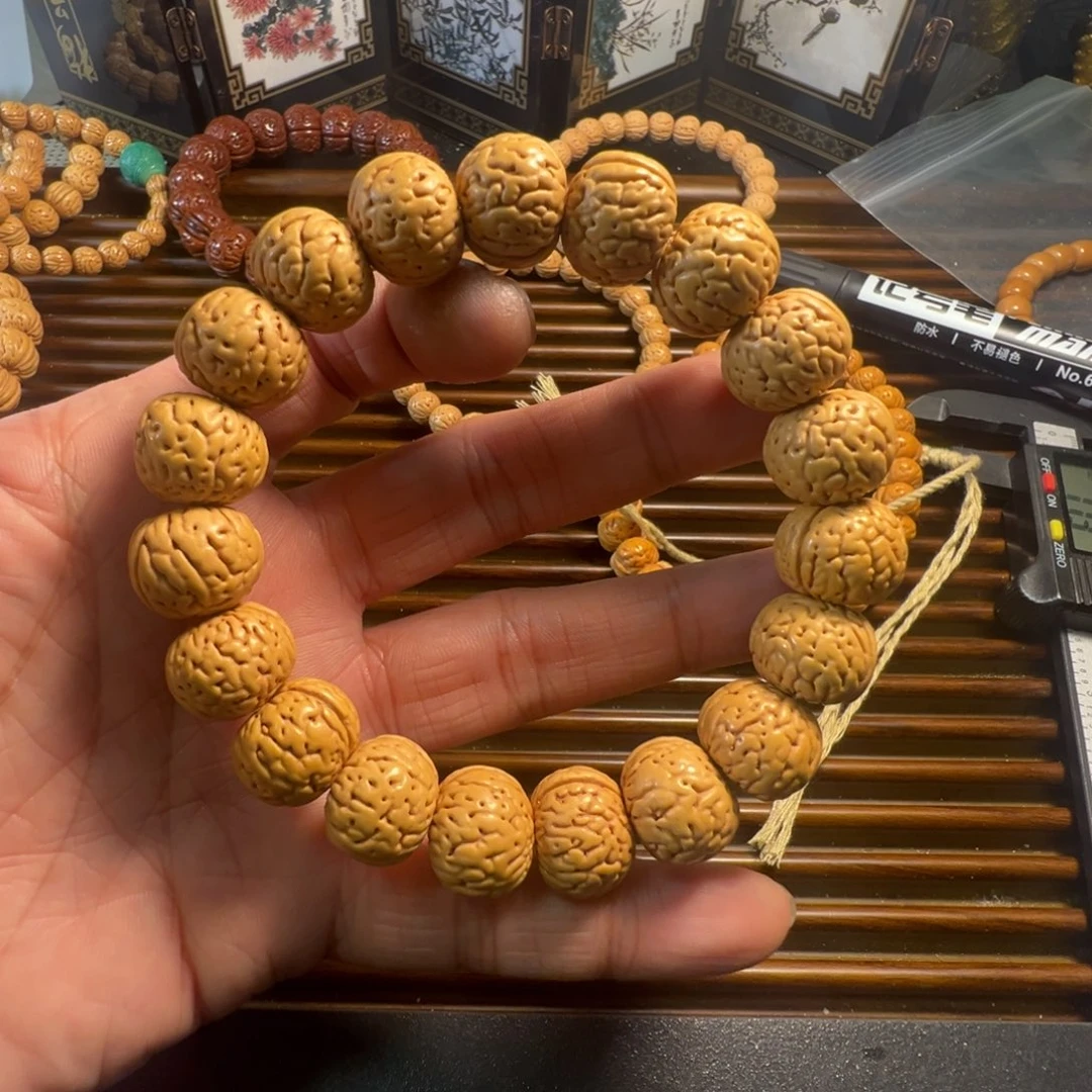 楚***辞桃木奶油金丹桃核手串