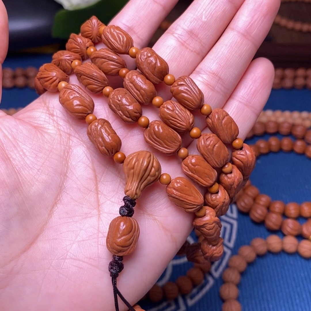 手串桃核8.5mm野生小金条长挂54+6颗