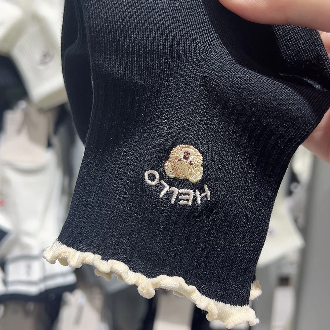 非金属仿珍珠黑色白边小熊袜子