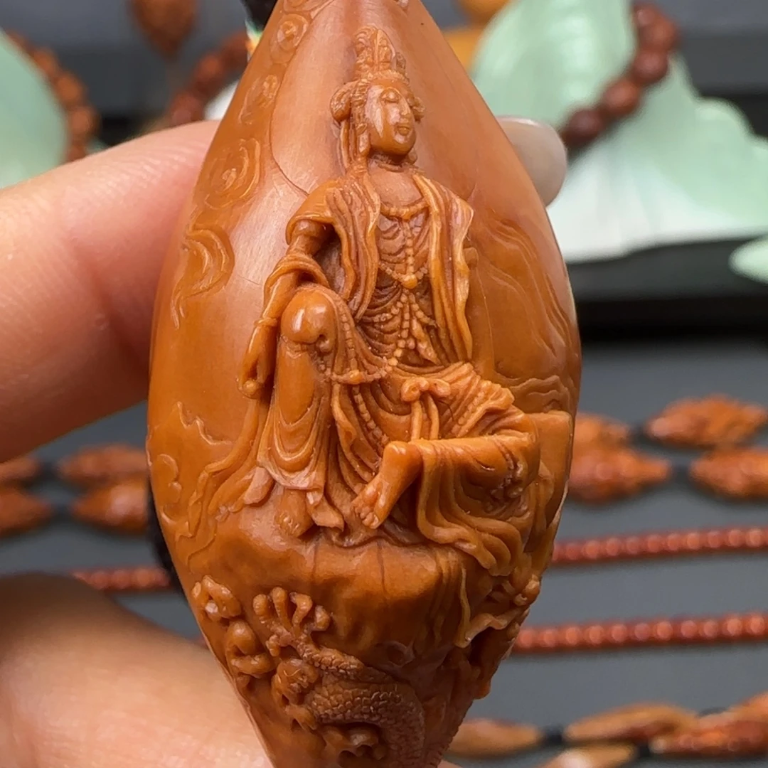 橄榄核吊坠油核浮雕自在观音