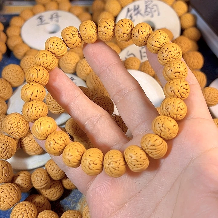 蓝***菲手串桃核树王纽扣桃核手串