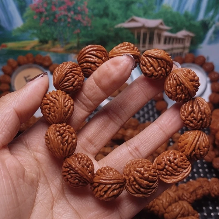 葑***鑀吊坠文玩核桃龙纹桃核手串