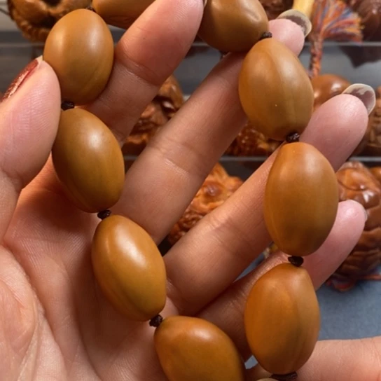 橄榄核吊坠巴西一龙九凤