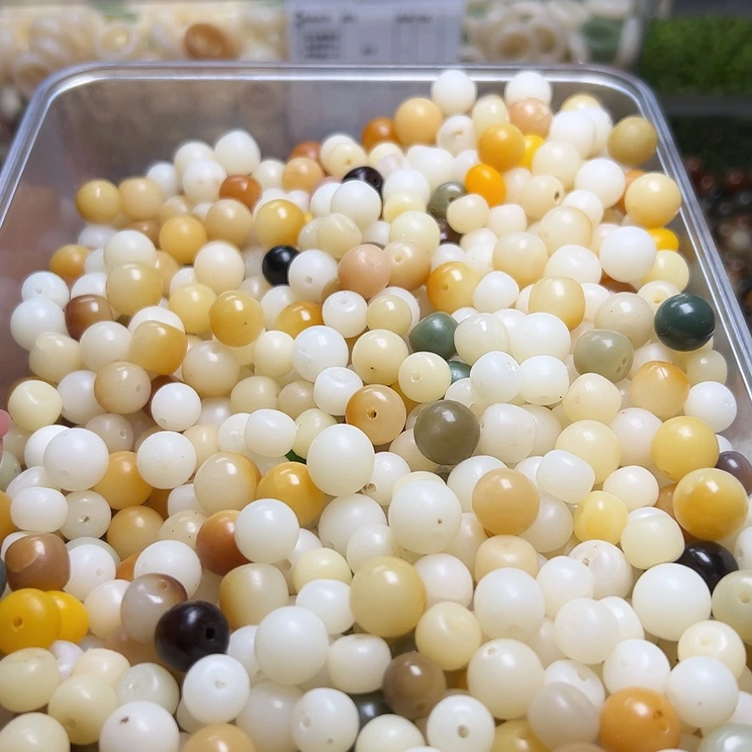 白玉菩提吊坠瑕疵炭烧混300颗