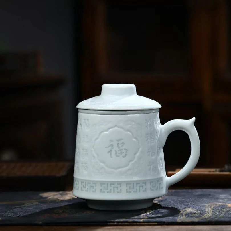 景德镇雕刻水杯影青玲珑浮雕茶杯陶瓷茶水分离办公室过滤礼品带盖