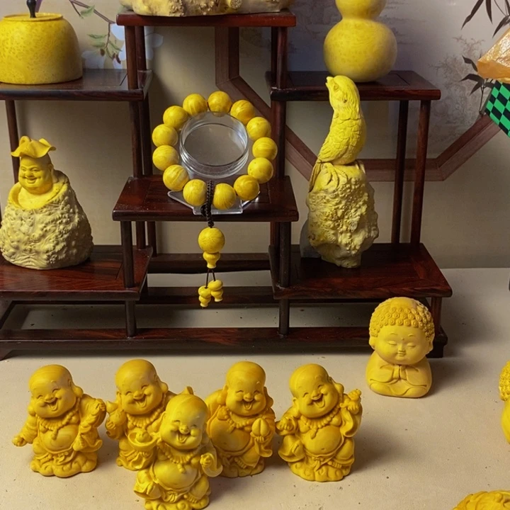 ****^黄杨木手把手把件