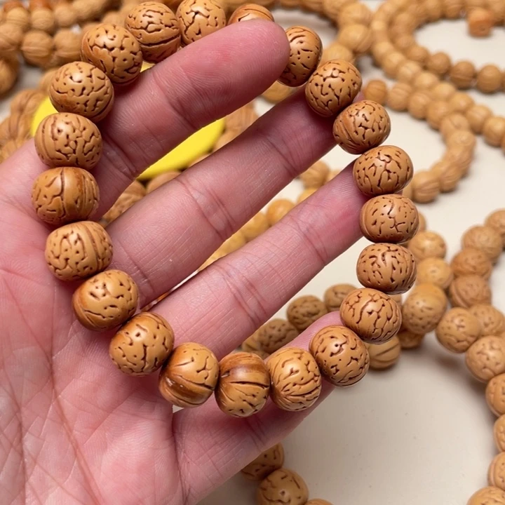 A***叔吊坠桃核留纹光珠