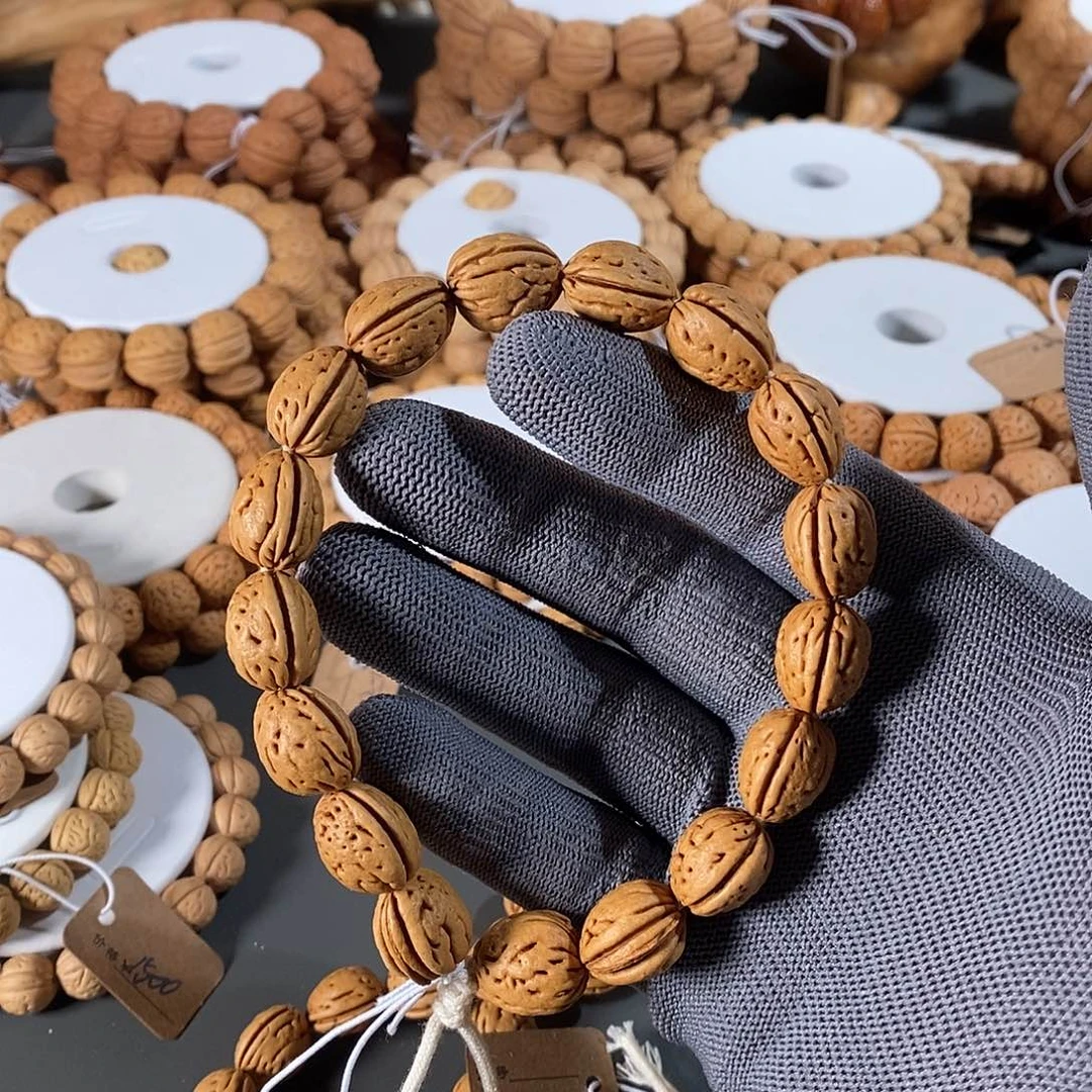 桃核手串1*。145盘锦小虎牙