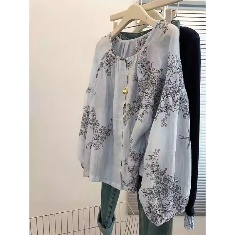 法式独特超好看气质上衣2025春季高级感轻奢减龄洋气蓝色印花衬衫