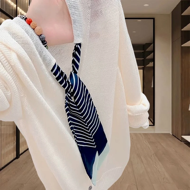 小众休闲百搭针织衫2025早秋新款女士宽松显瘦白色v领长袖上衣服
