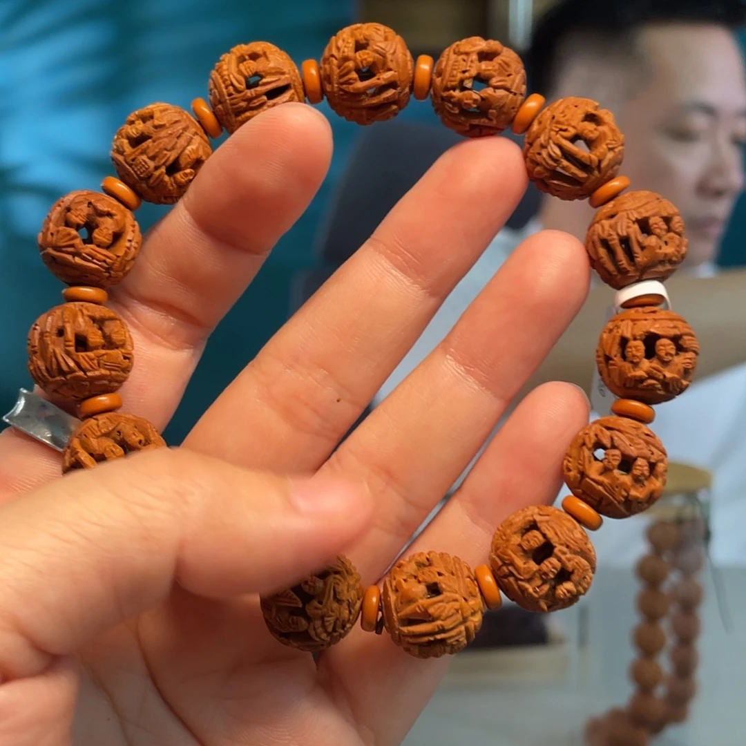 山桃核竹林罗汉核雕作品