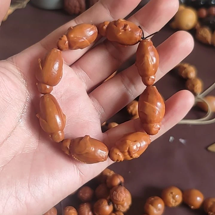 石英石铁合金橄榄核手串弥勒佛