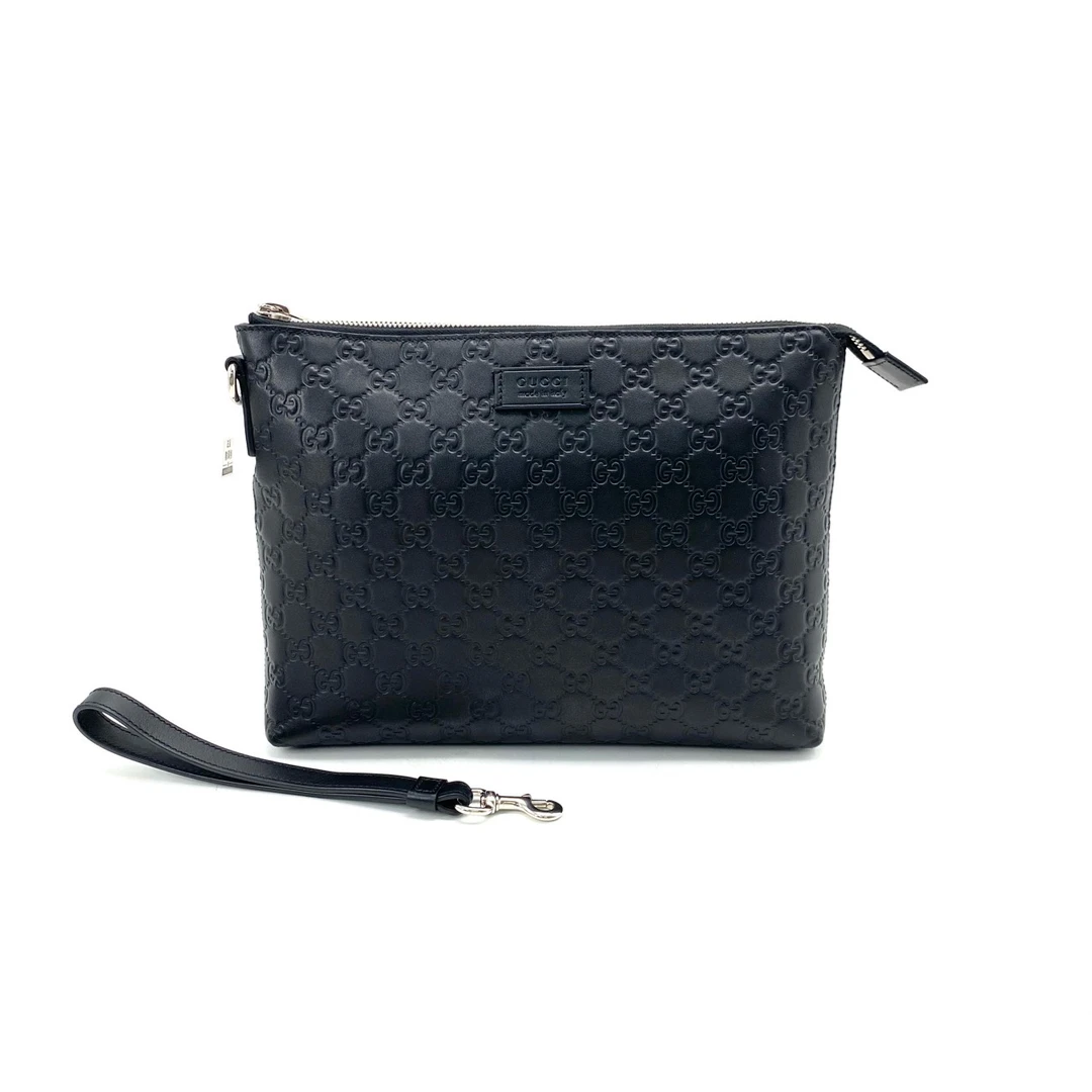 99新 GUCCI/古驰 经典休闲时尚轻便黑色全皮压花手拿包 尺寸30/23