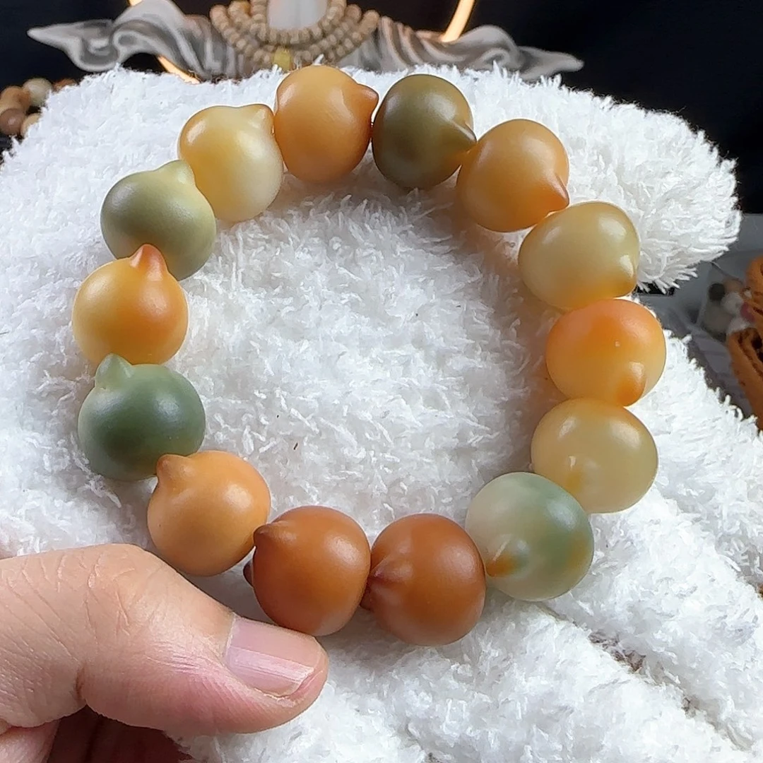 菩提根/象牙果手串工***队瑕疵卡18猫头手串一条