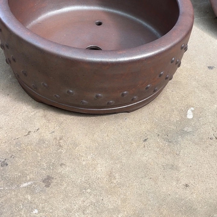 少***子紫砂花盆宜兴紫砂工艺厂。