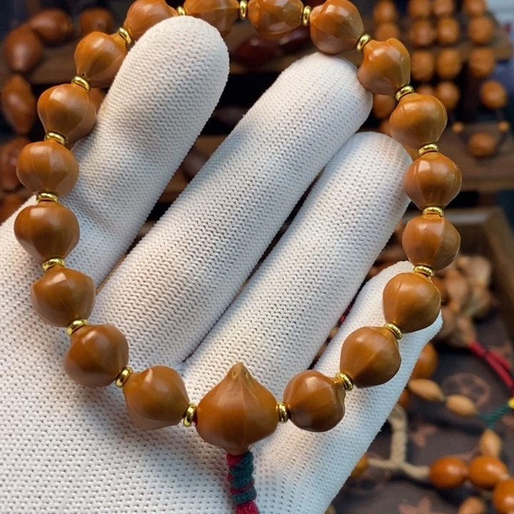 橄榄核手串/手链1.1水晶核四花蜜桃臀