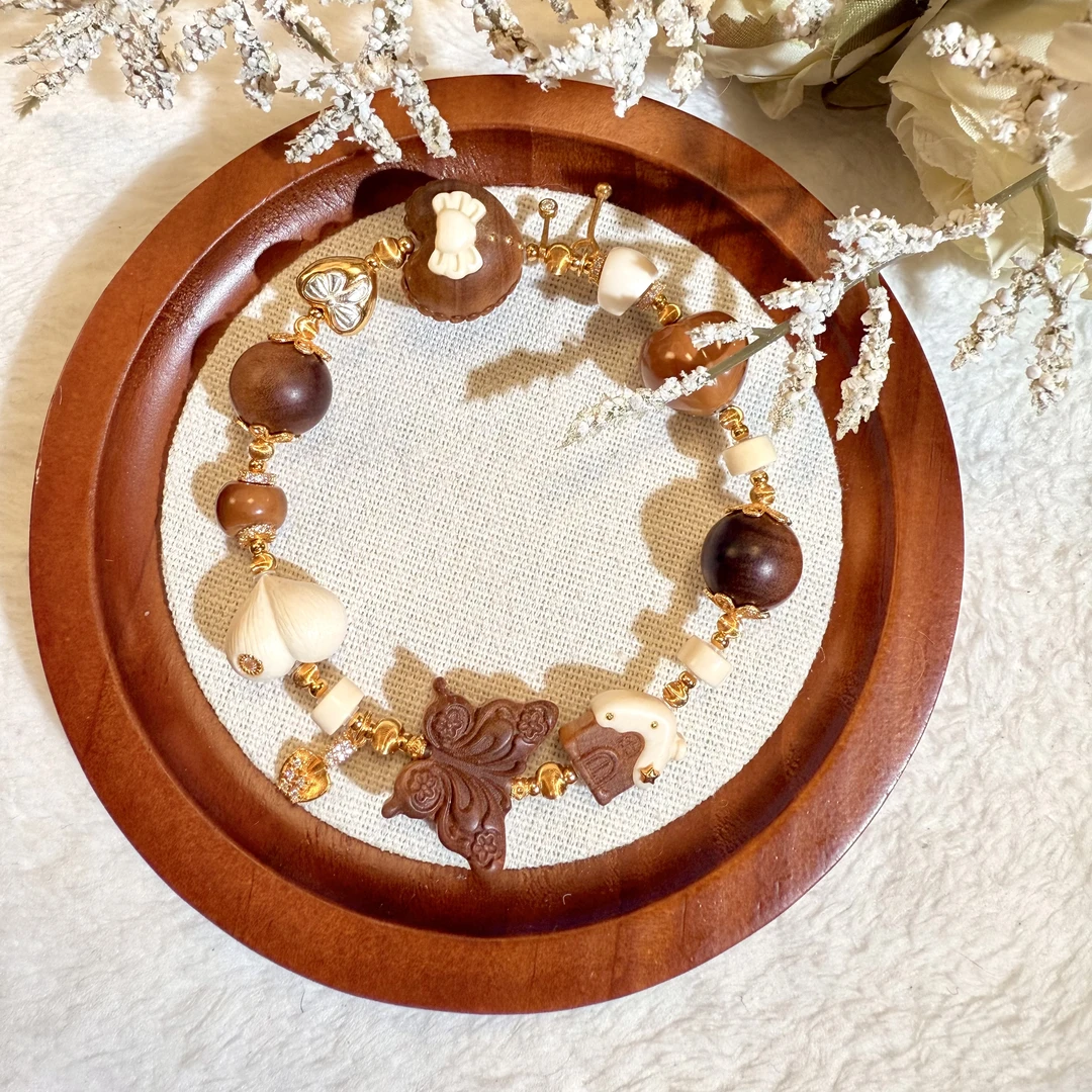 蝴蝶结爱心猛犸老山檀屁桃多宝925手串