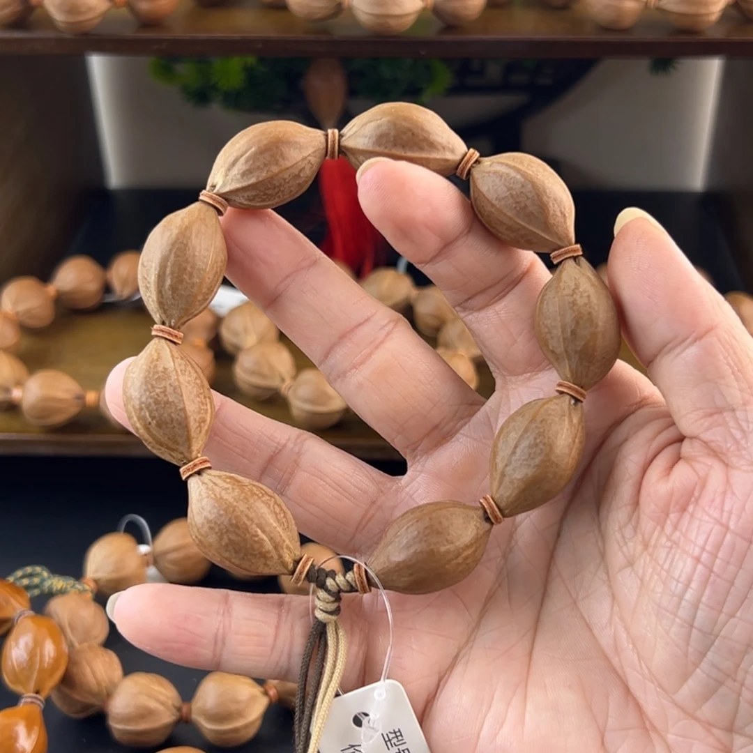 橄榄核吊坠梅林铁核老树核素串18.528