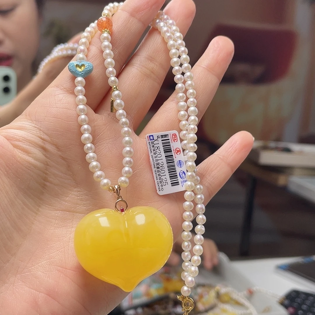 琥珀18K金镶嵌裸石吊坠