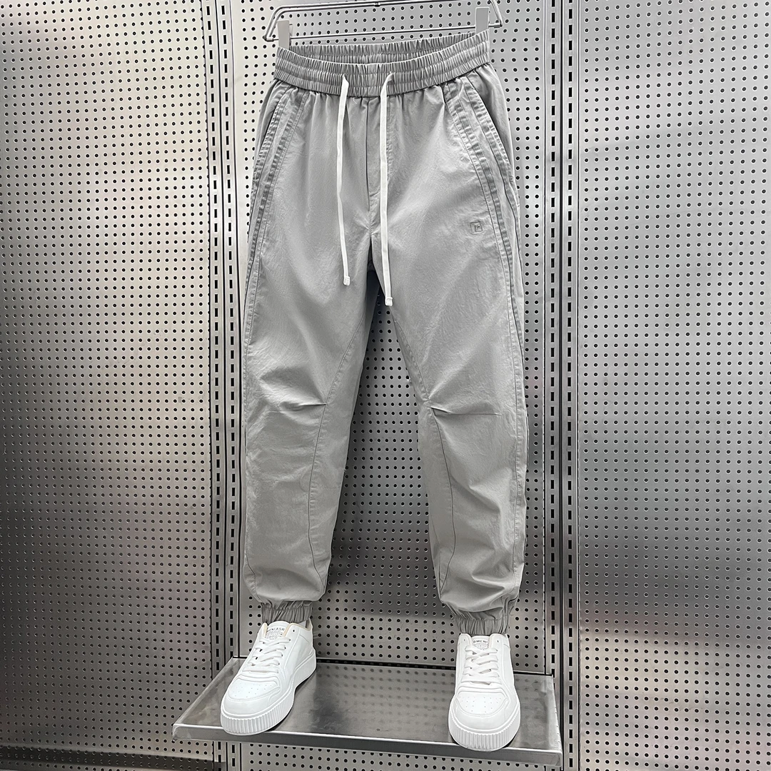 2025潮流男士新款纯色拼条休闲裤弹力松紧腰小束脚韩版