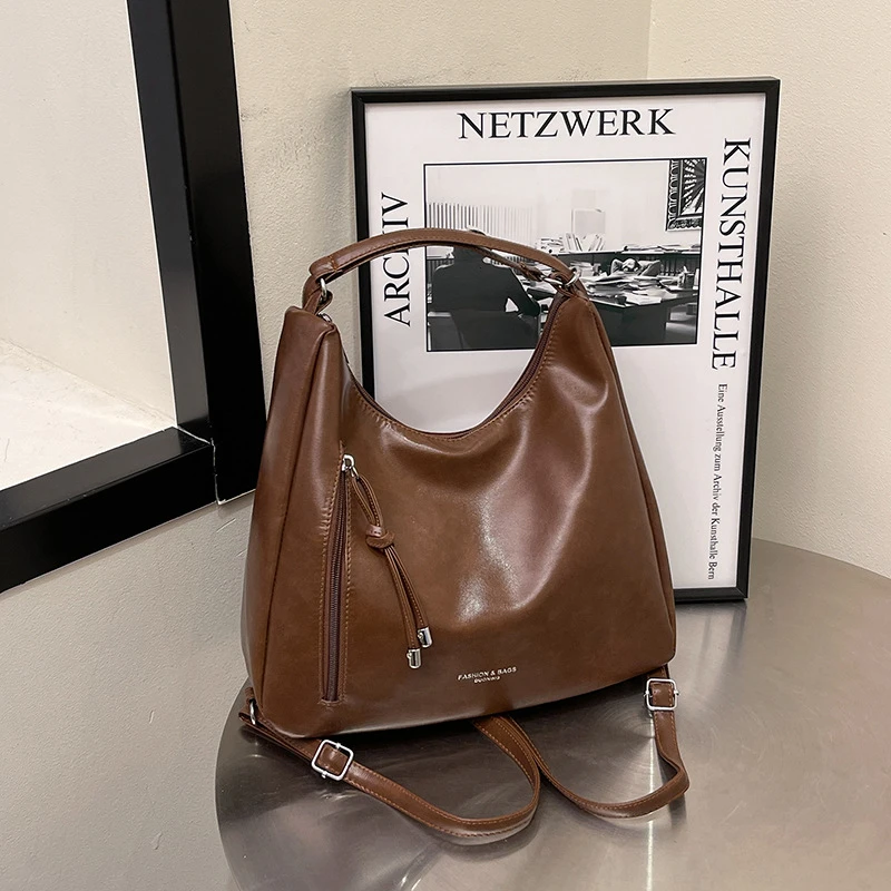 单肩双肩包女2025新款通勤腋下包春季流行大学生上课后背包托特包