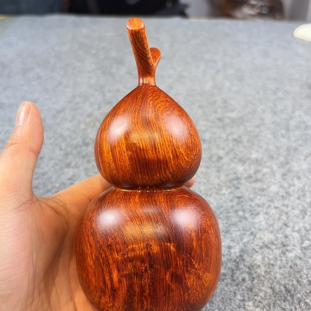 网***络花梨木类紫油梨把件摆件