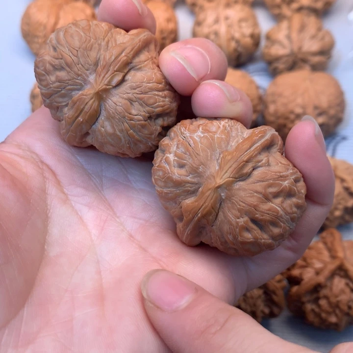 翼***田文玩核桃把件元宝