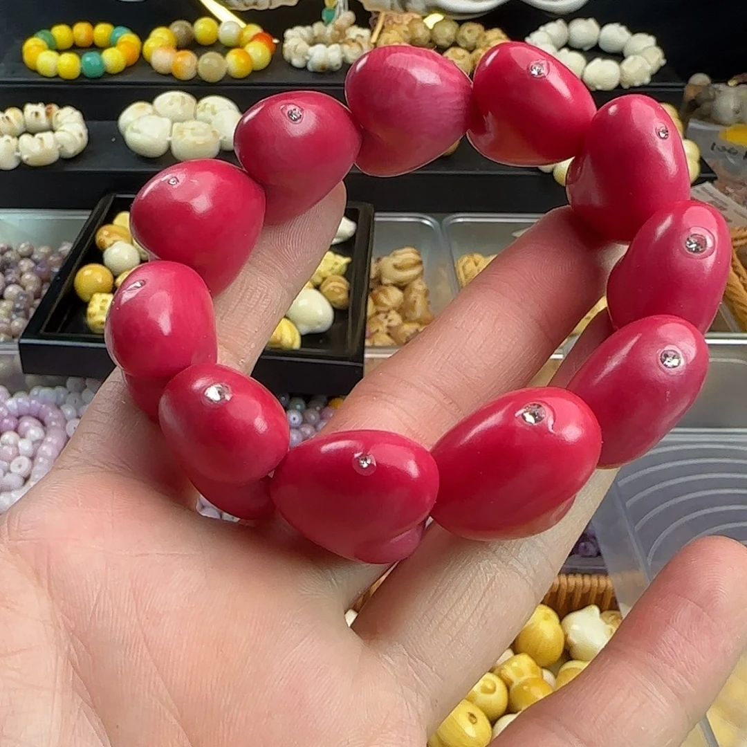 菩提根/象牙果吊坠微瑕疵粉色爱心手串一条