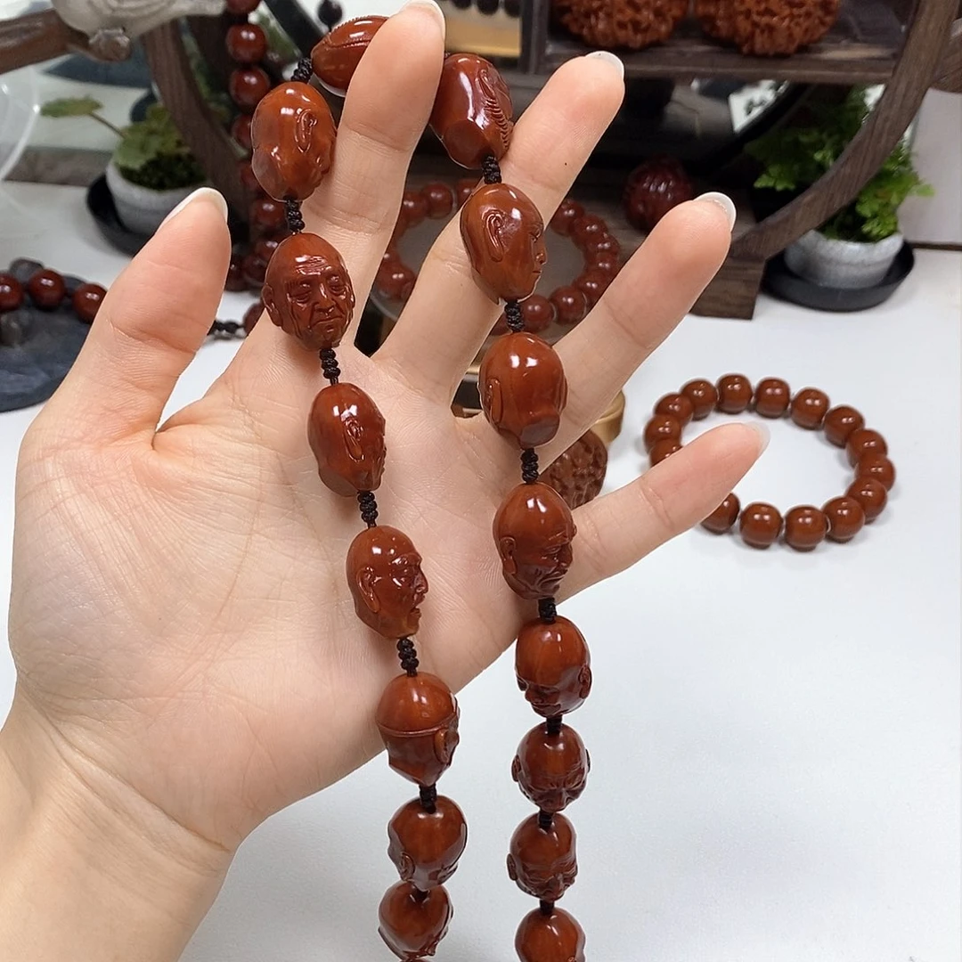 橄榄核把件?**?十八罗汉手持