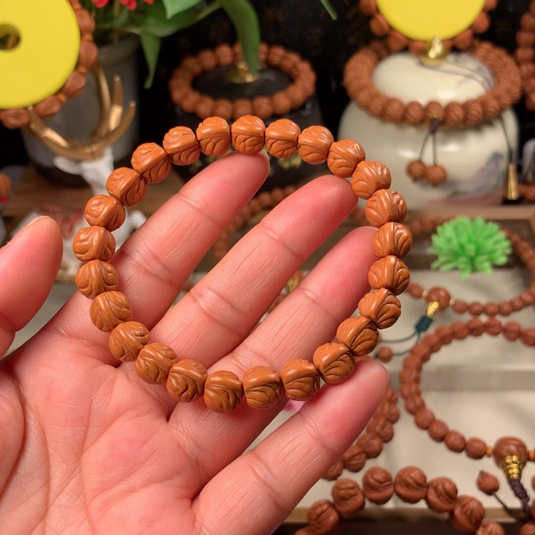 A***e桃核吊坠金玉龙手串10