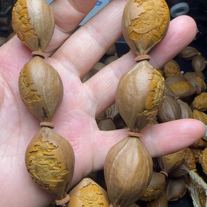 哥***7橄榄核雕刻手串关公