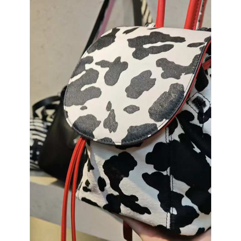 YUSHA/高档黑拼白小可奶牛双肩包-G312