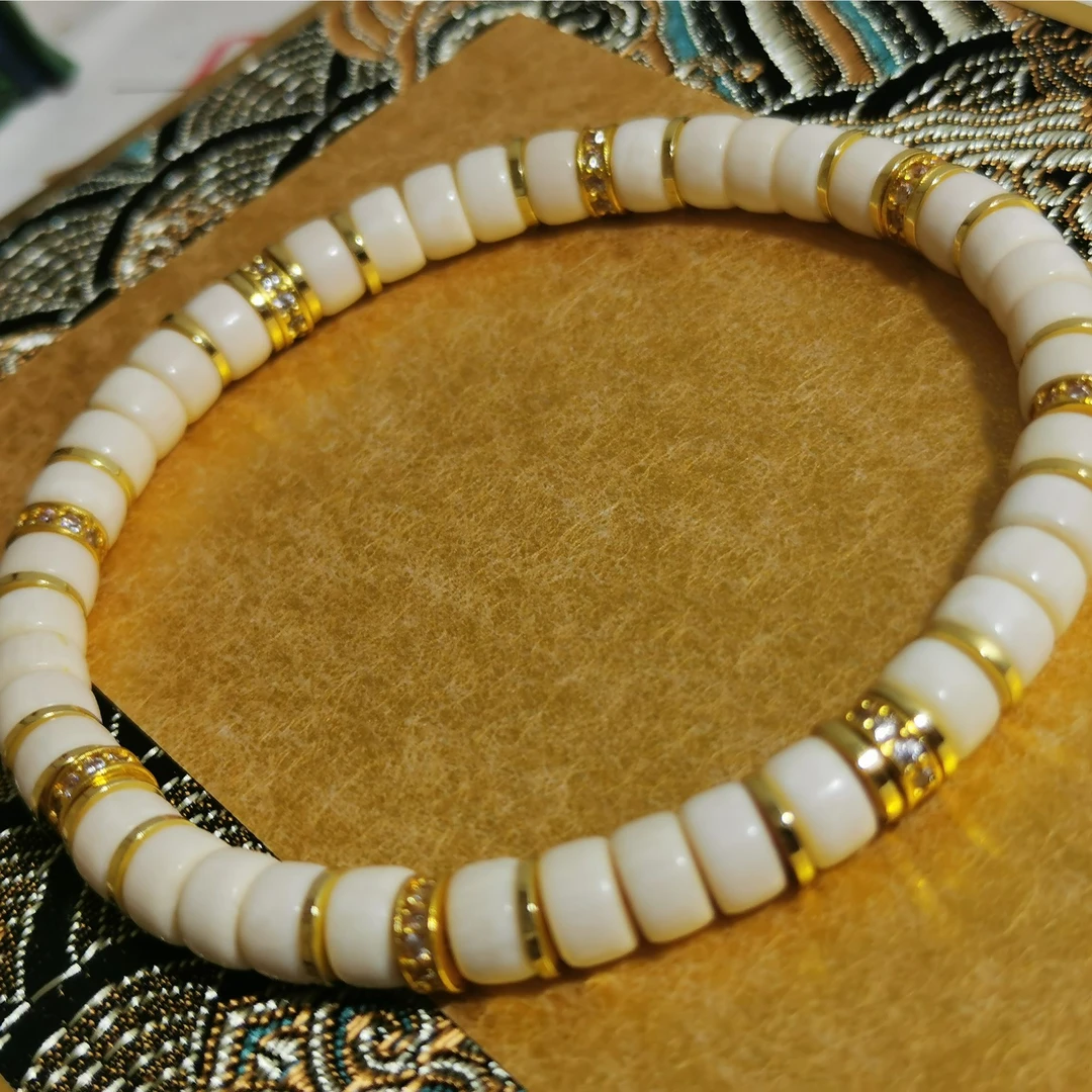 80266【金粉世家】精品猛犸象牙6*4左右原创单圈药片手串