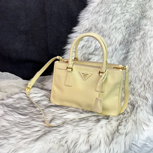 95新 Prada/普拉达 小鸡黄小号杀手手提斜挎包