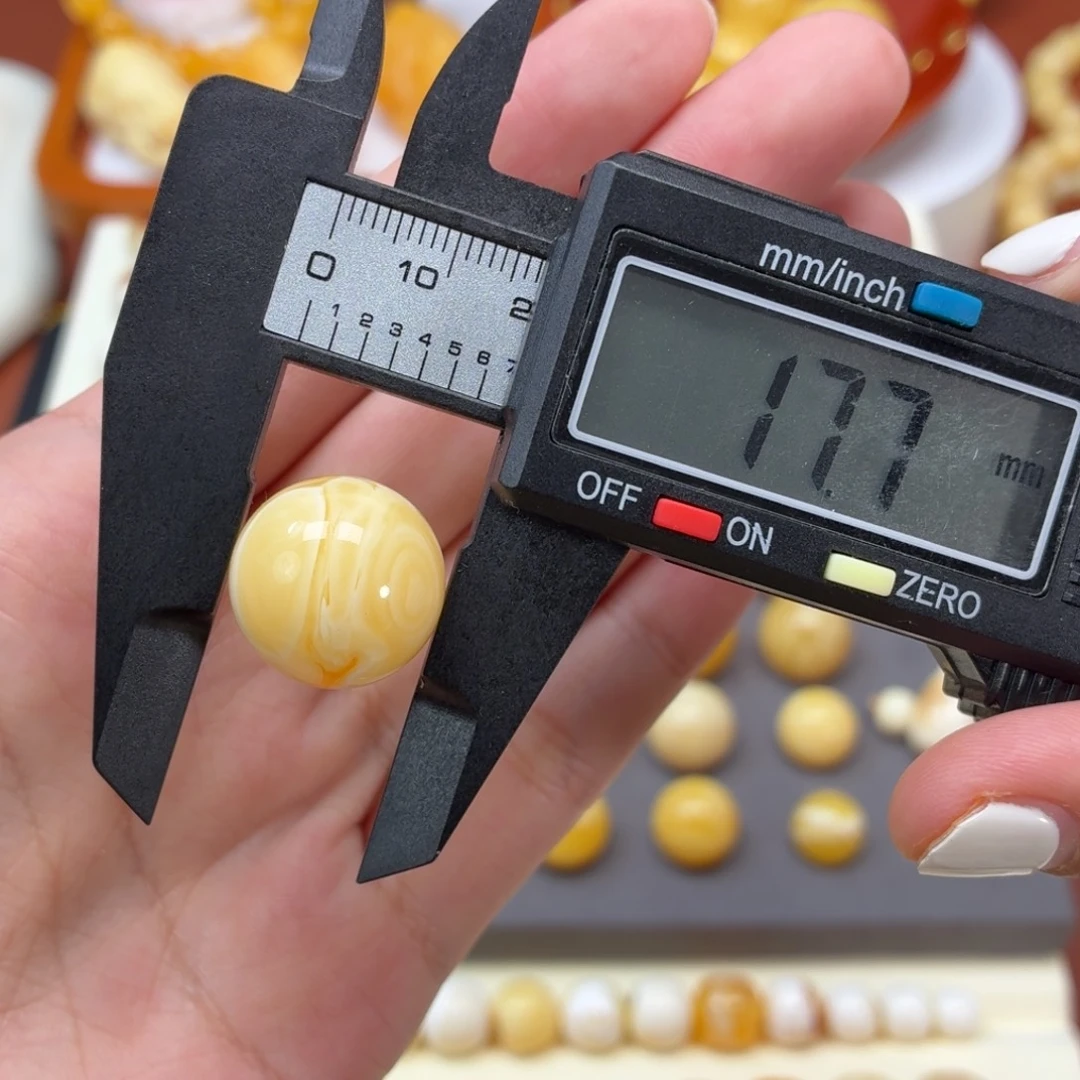 琥珀未镶嵌珠宝奇石焦皮奶橘双瞳溶洞圆珠17.7mm